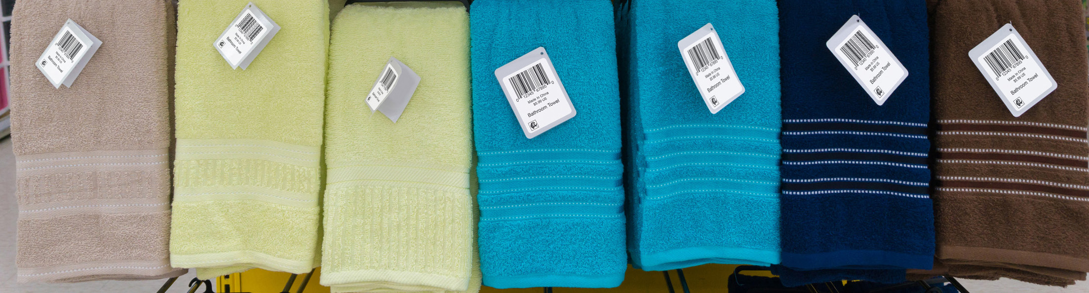 Barcode labels applied to retail towels for inventory control
