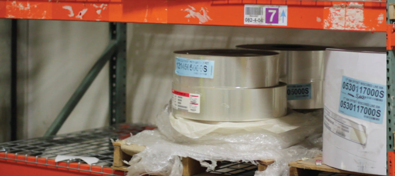 Before CleanBeam: rack beam with peeling paint, scraped labels and leftover adhesive